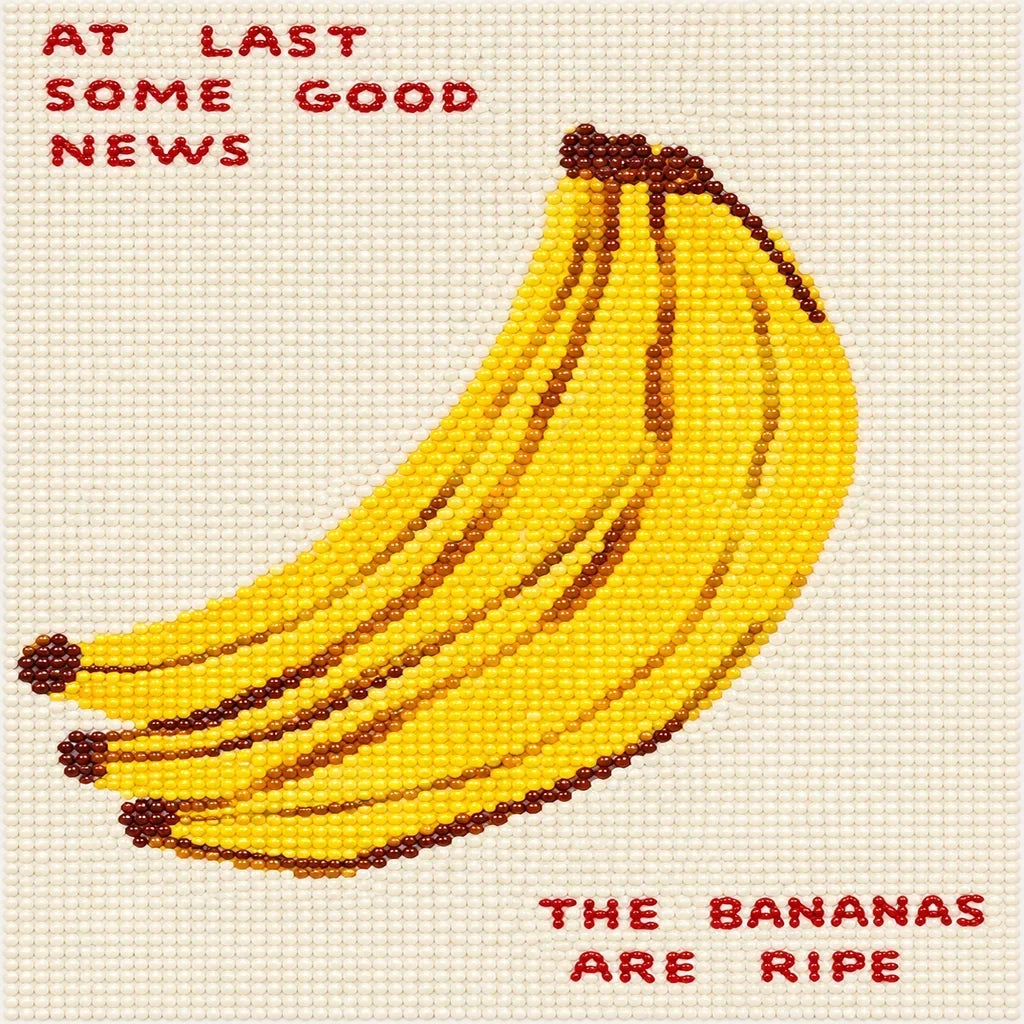 Finished banana diamond painting with the yellow fruit design covered in resin drills.