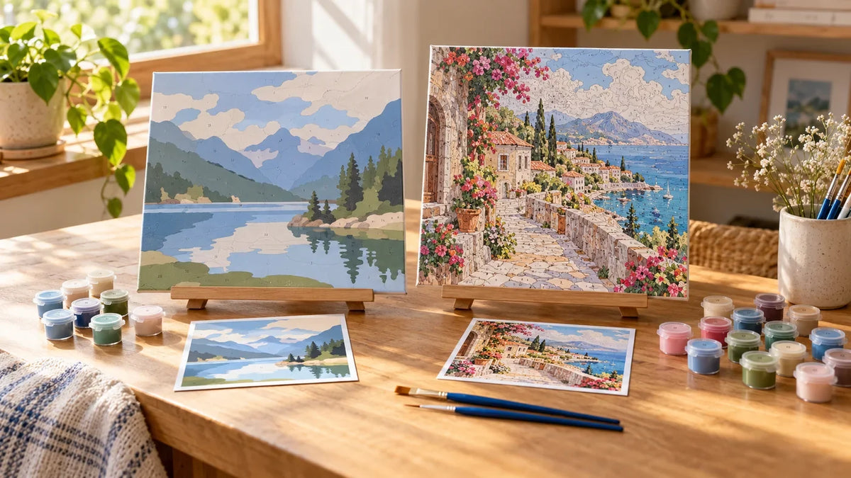 Two paint-by-numbers canvases with paint pots arranged for kit comparison