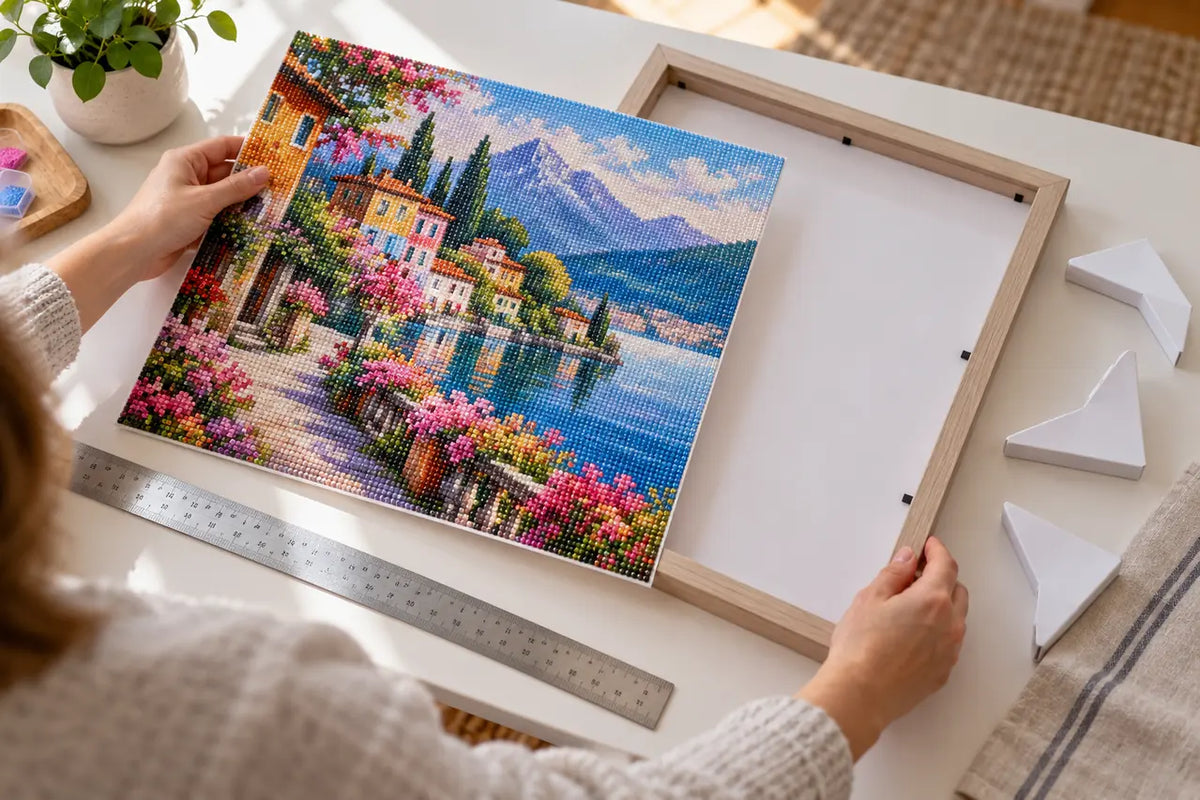 Hands measuring a completed diamond painting before fitting it in a simple frame