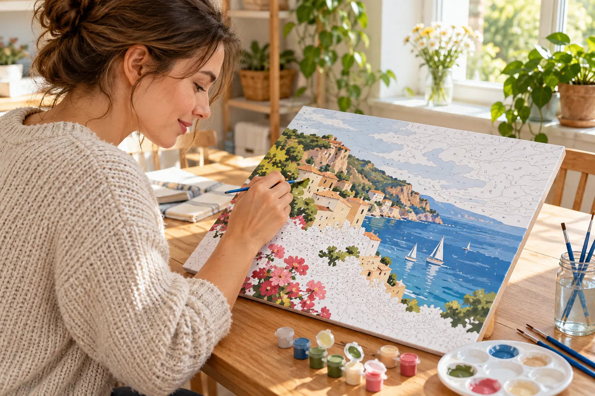 A beginner painting numbered canvas sections with small brushes at a bright home craft table