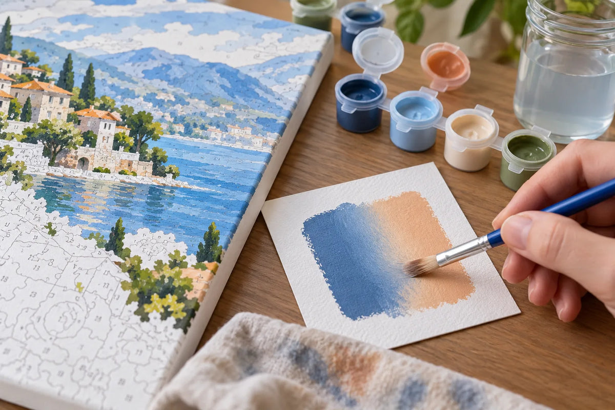 A painter uses a clean brush to soften a boundary between adjacent colors on a numbered canvas