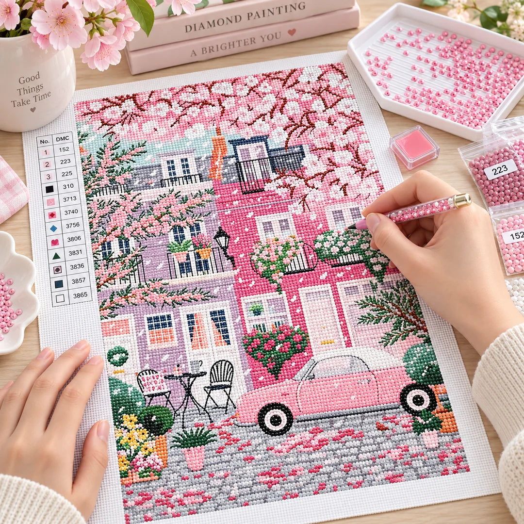 Hand placing resin drills on the cherry blossom canvas, diamond painting kit