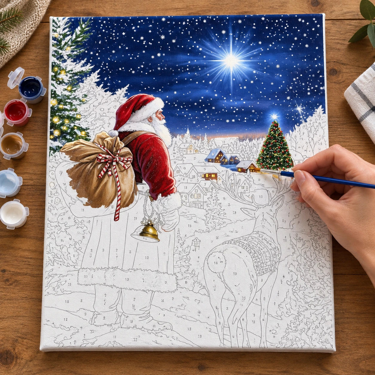 Complete Beneath the Christmas Star numbered canvas being painted with acrylic paints and brushes