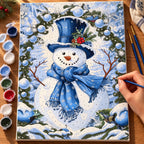 Complete Blue Scarf Snowman numbered canvas being painted with acrylic paints and brushes