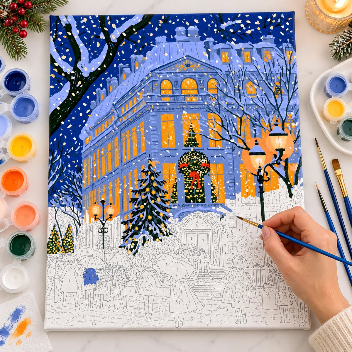 Complete Blue Snowy European Christmas Building numbered canvas being painted with acrylic paints and brushes