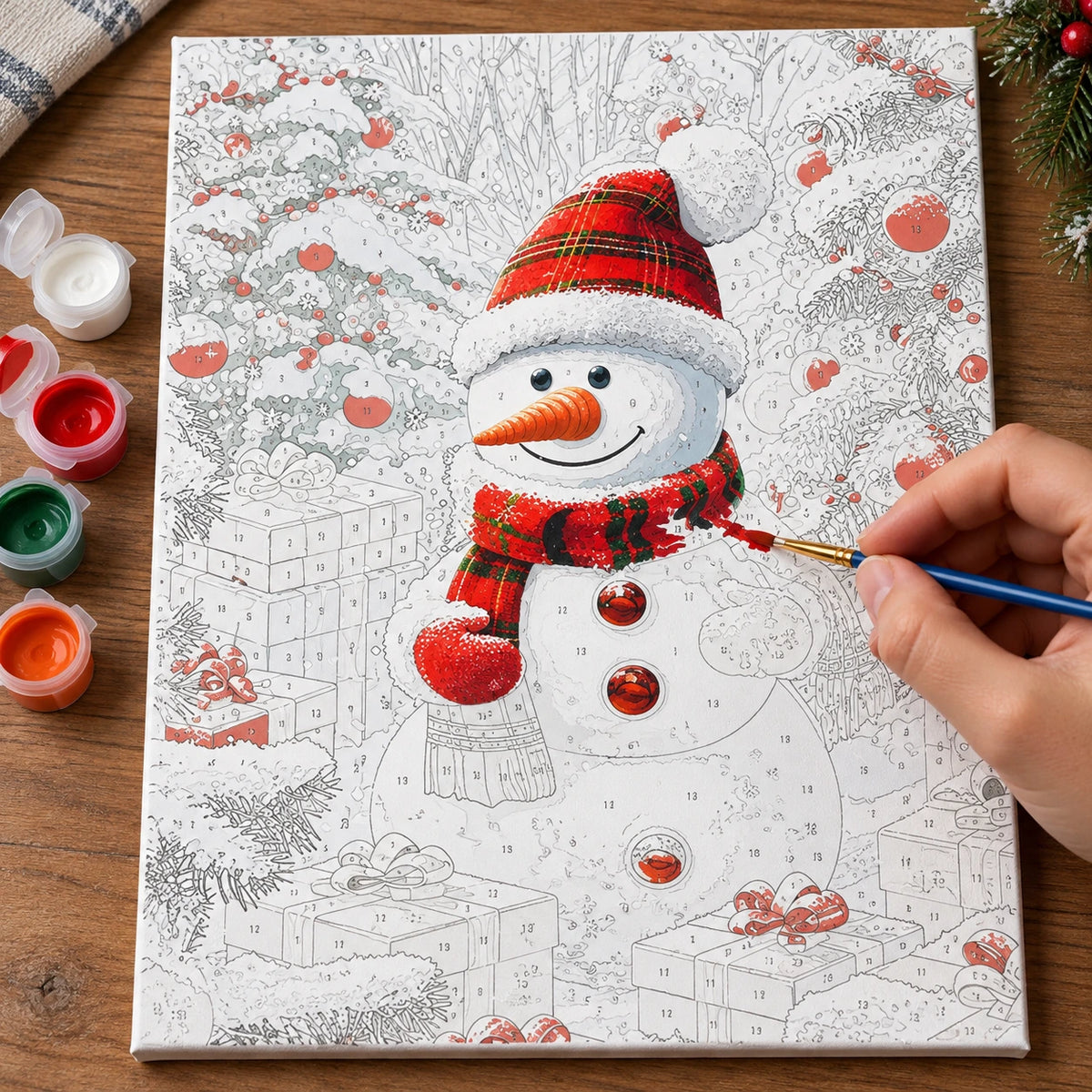 Complete The Christmas Giftkeeper numbered canvas being painted with acrylic paints and brushes