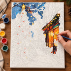 Complete Christmas Glow on a Snowy Street numbered canvas being painted with acrylic paints and brushes