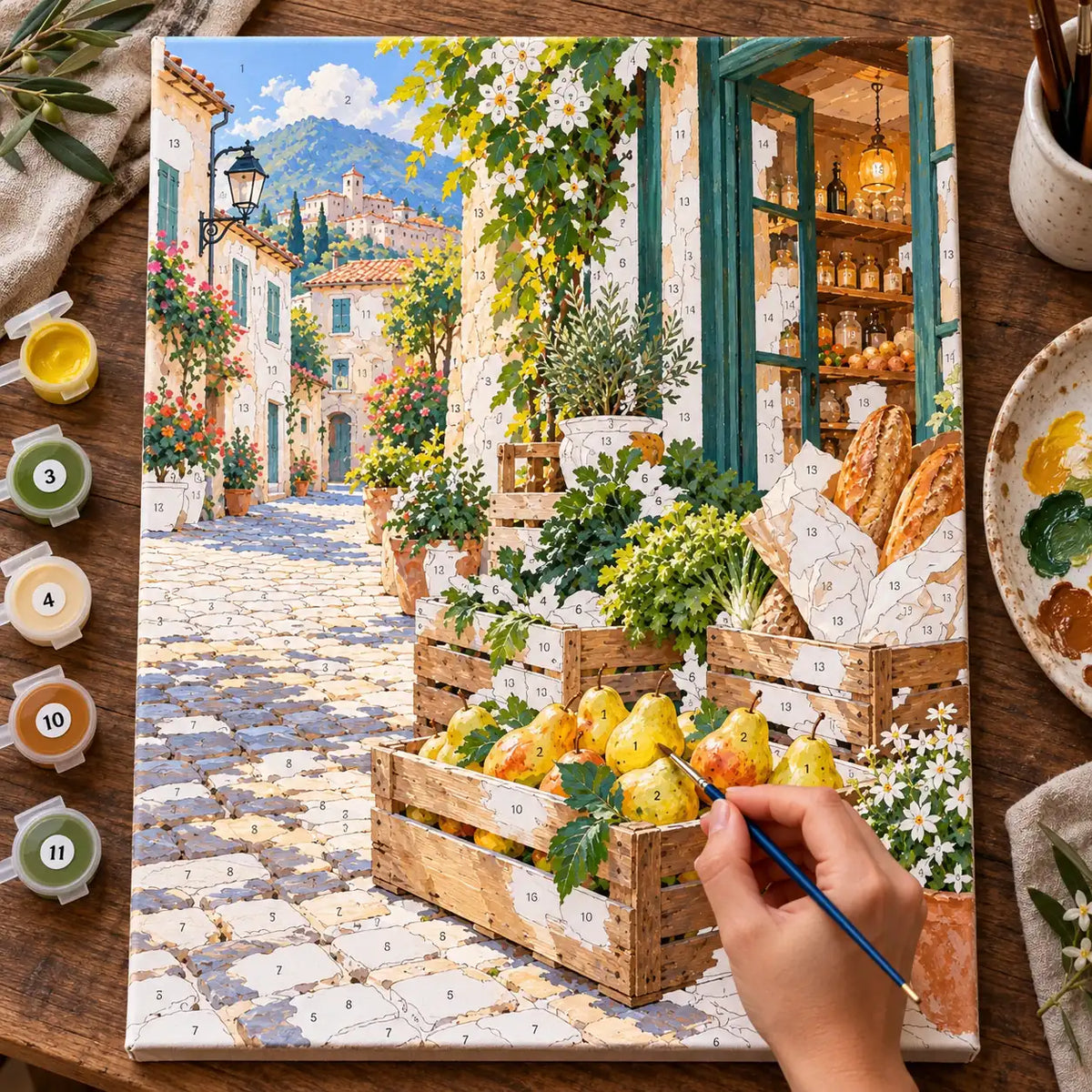 `04-corner-grocer-wooden-crates-painting-process.webp` — Painting process scene for the Corner Grocer Wooden Crates kit, with the complete numbered canvas and painting tools.