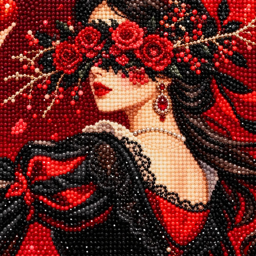 Close-up diamond drill detail of a red rose crown and crimson bridal gown