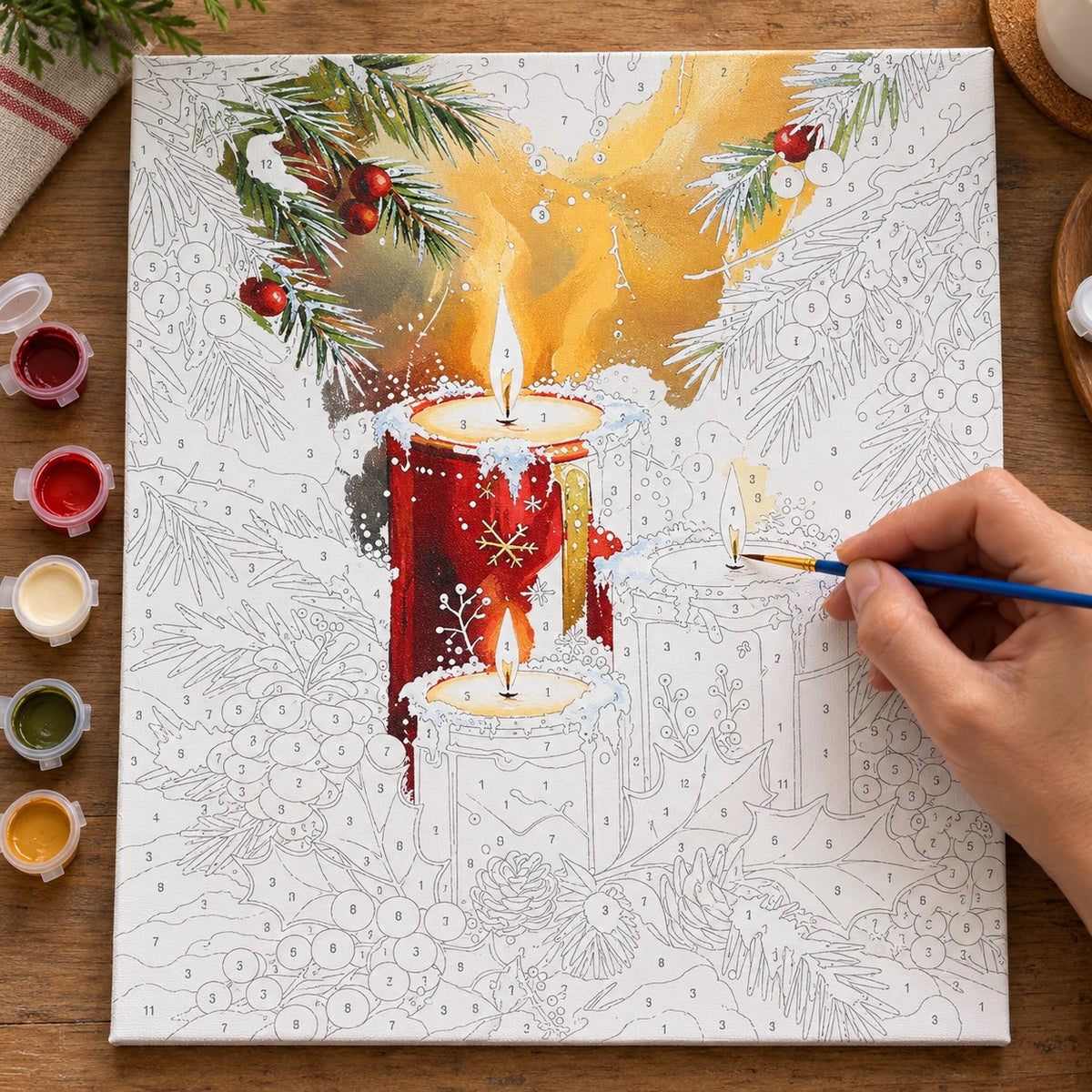 Complete Crimson Candlelight Christmas numbered canvas being painted with acrylic paints and brushes