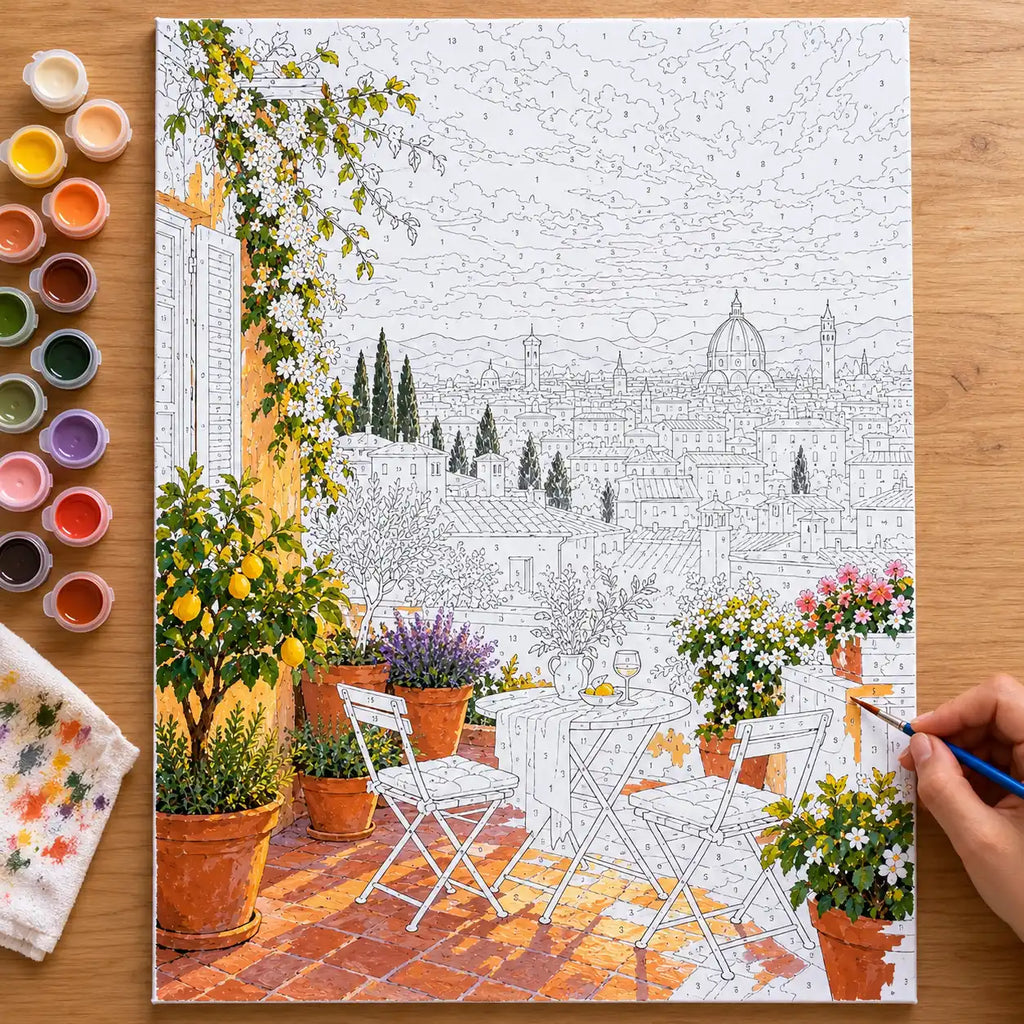 `04-florence-rooftop-terrace-duomo-sunset-painting-process.webp` — Numbered Florence rooftop terrace canvas being painted with acrylic colors, with the complete canvas edges visible.