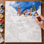 Complete Glow Over the Snowy Village numbered canvas being painted with acrylic paints and brushes