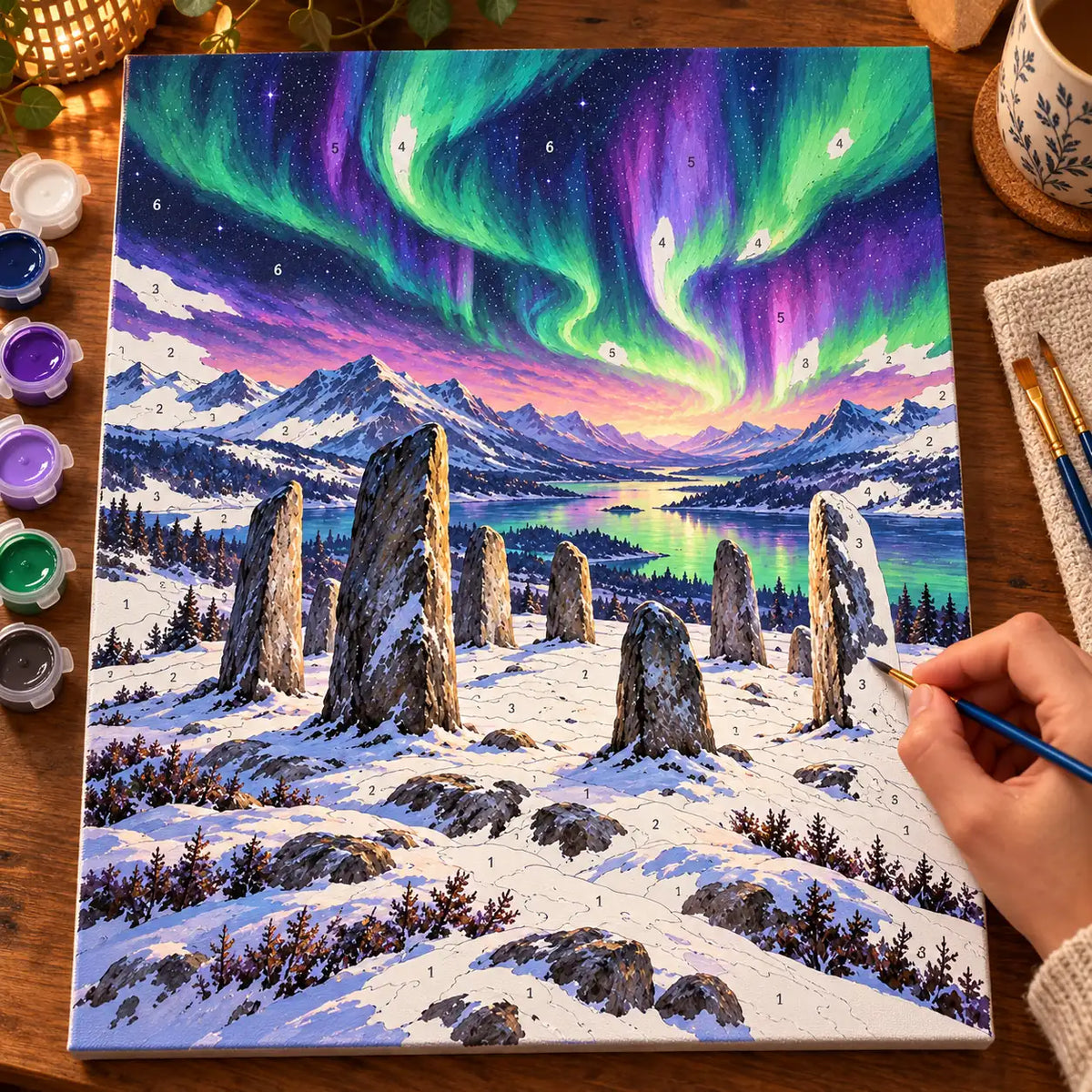 Painting process scene for the Runestone Circle Beneath the Aurora kit, showing its complete numbered canvas and painting tools.
