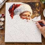 Complete Santa’s Festive Smile numbered canvas being painted with acrylic paints and brushes