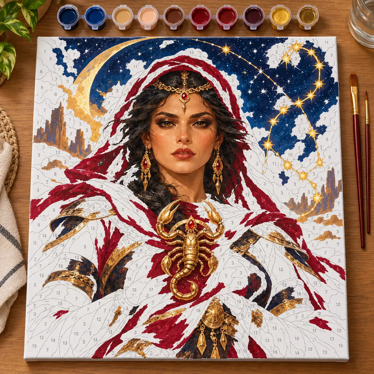 Painting process scene for the Scorpio Scorpion Guardian Portrait kit, with the complete numbered canvas and painting tools.