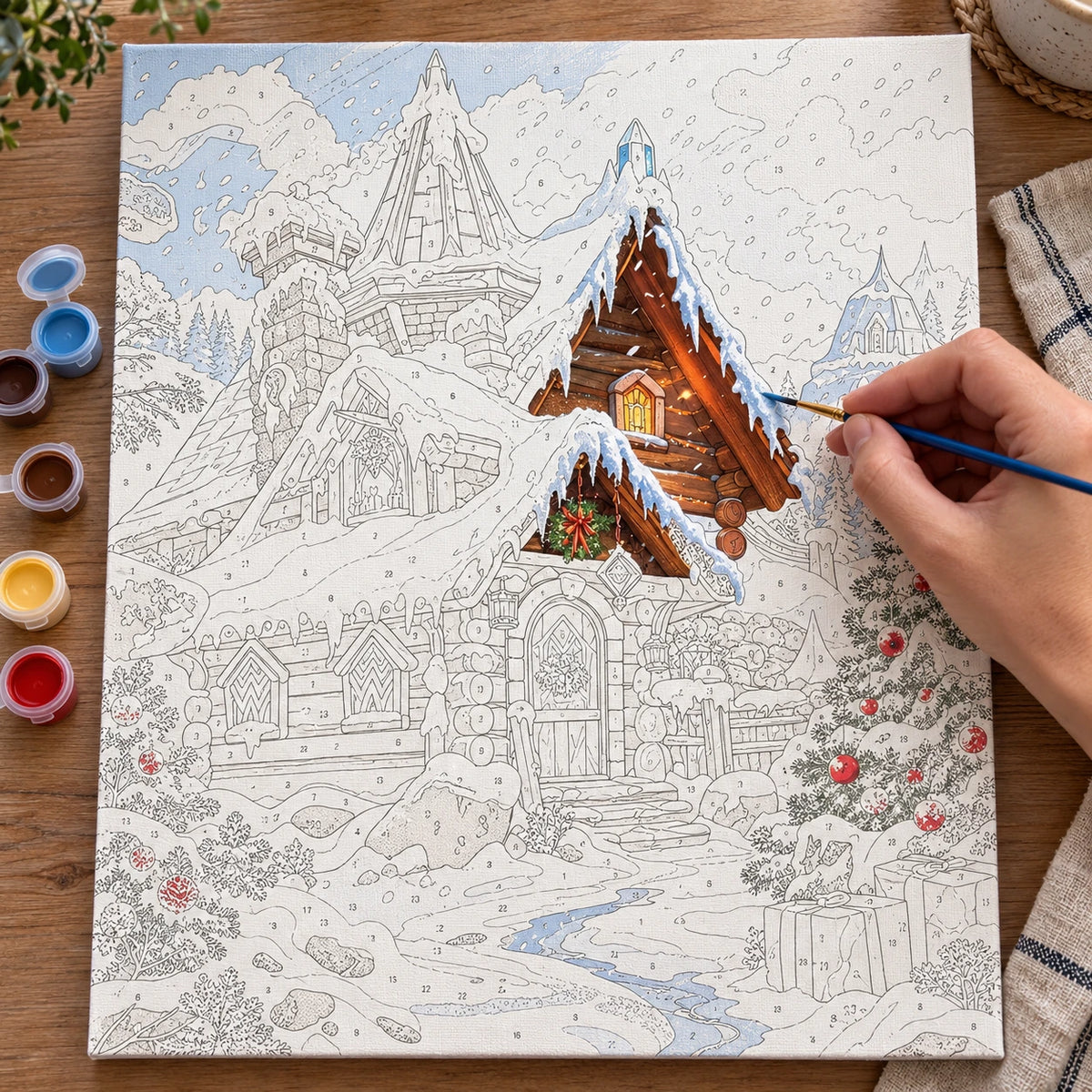 Complete Snowfall at Christmas Village numbered canvas being painted with acrylic paints and brushes