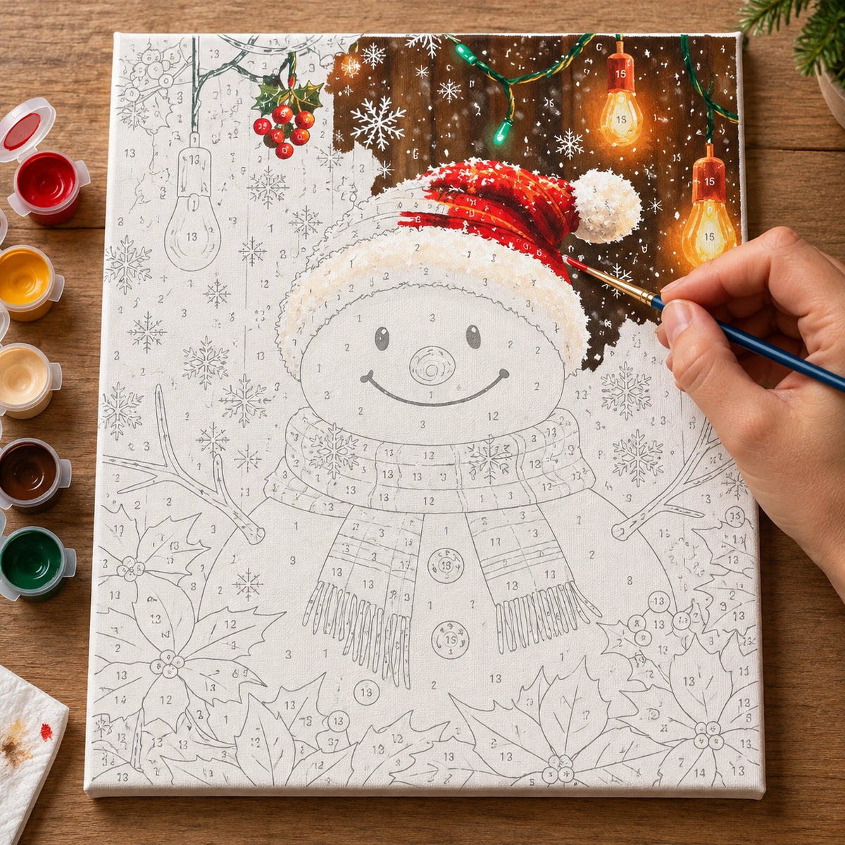 Complete Snowfall Santa Snowman numbered canvas being painted with acrylic paints and brushes