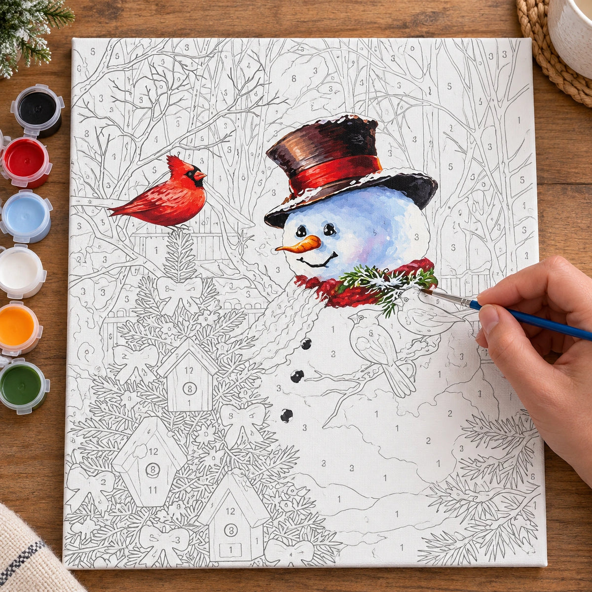 Complete Snowman Festive Bird Garden numbered canvas being painted with acrylic paints and brushes