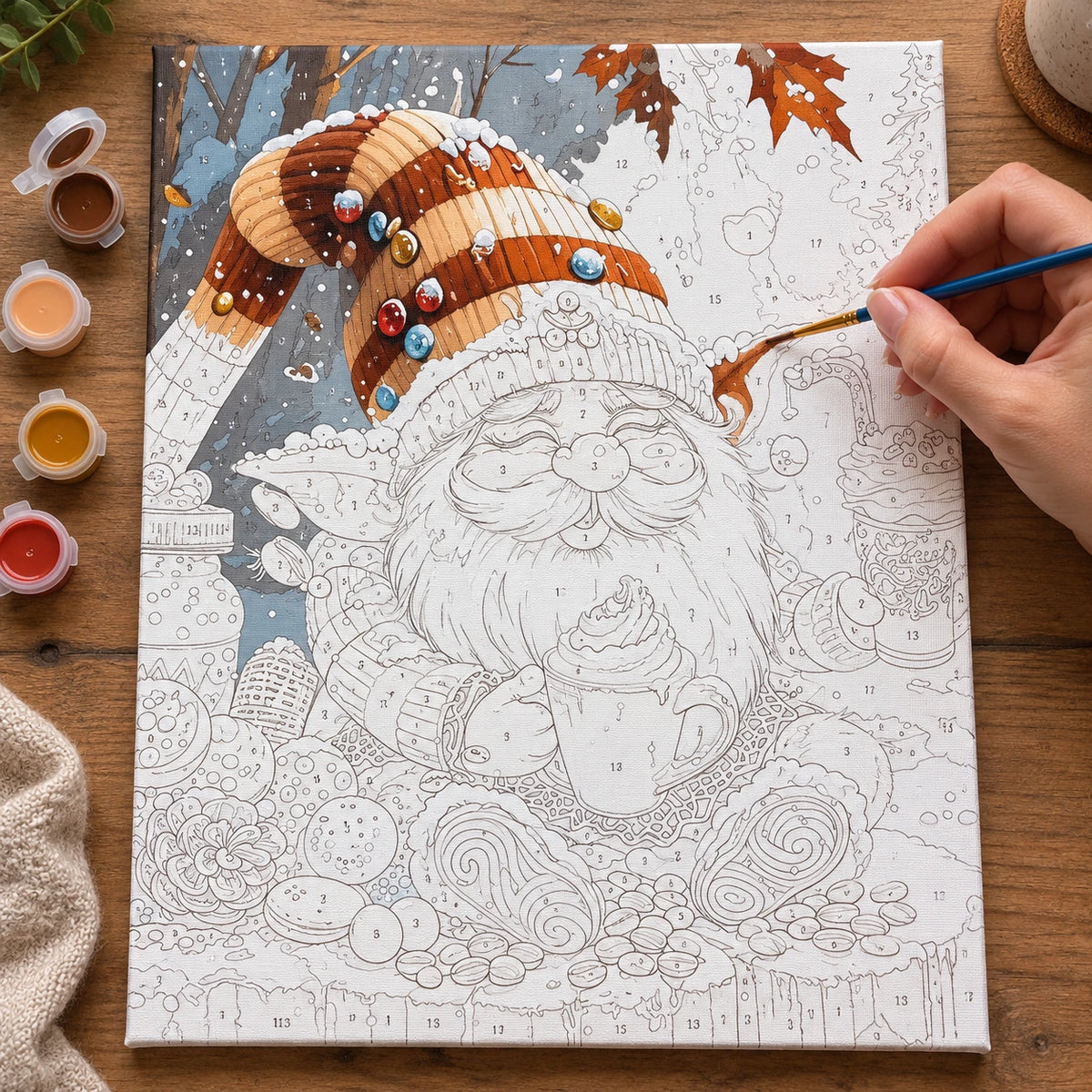 Complete Snowy Gnome Coffee Break numbered canvas being painted with acrylic paints and brushes