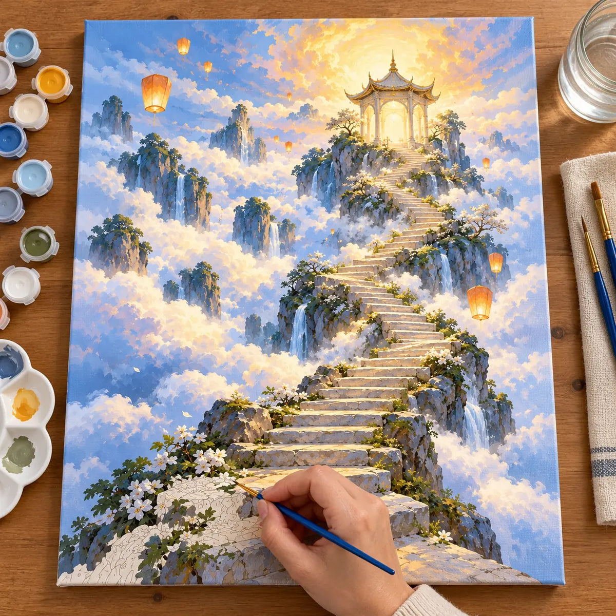 Painting process scene for the Stairway Cloud Temple kit, showing its complete numbered canvas and painting tools.
