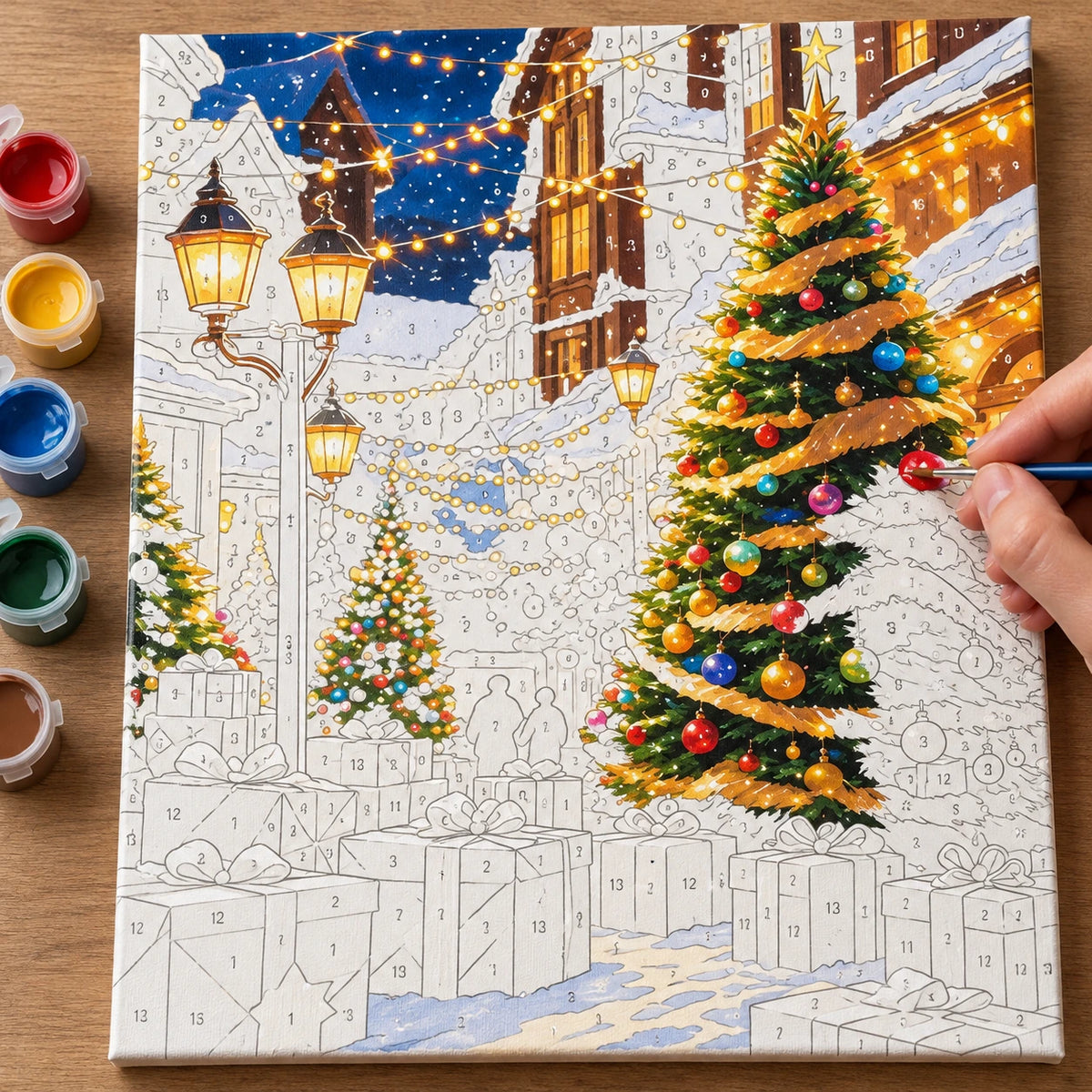 Complete Starlit Christmas Village numbered canvas being painted with acrylic paints and brushes