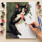 Complete Tuxedo Cat with a Pink Toy Mouse numbered canvas being painted with acrylic paints and brushes.