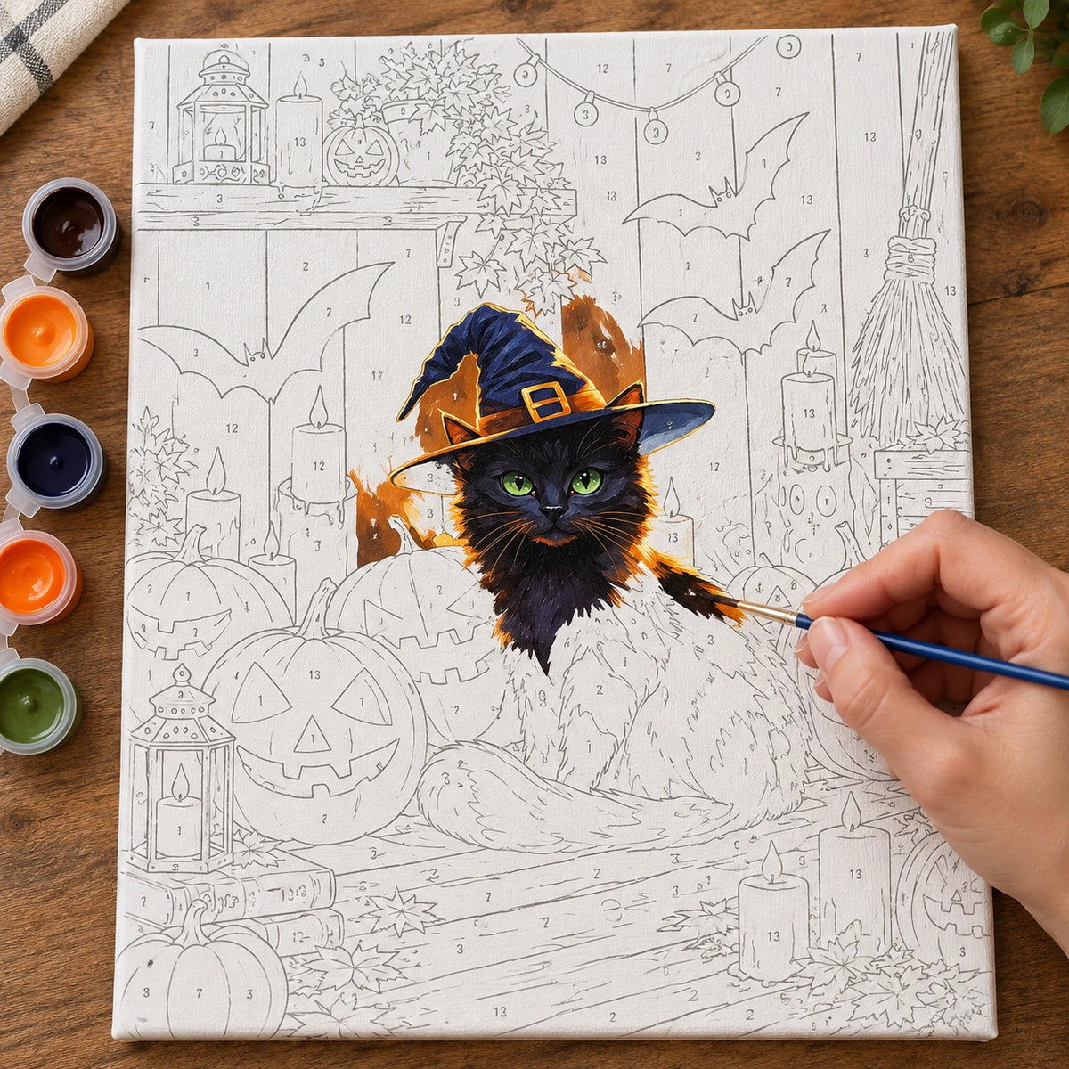 Complete Witch Halloween Companion Black Cat numbered canvas being painted with acrylic paints and brushes