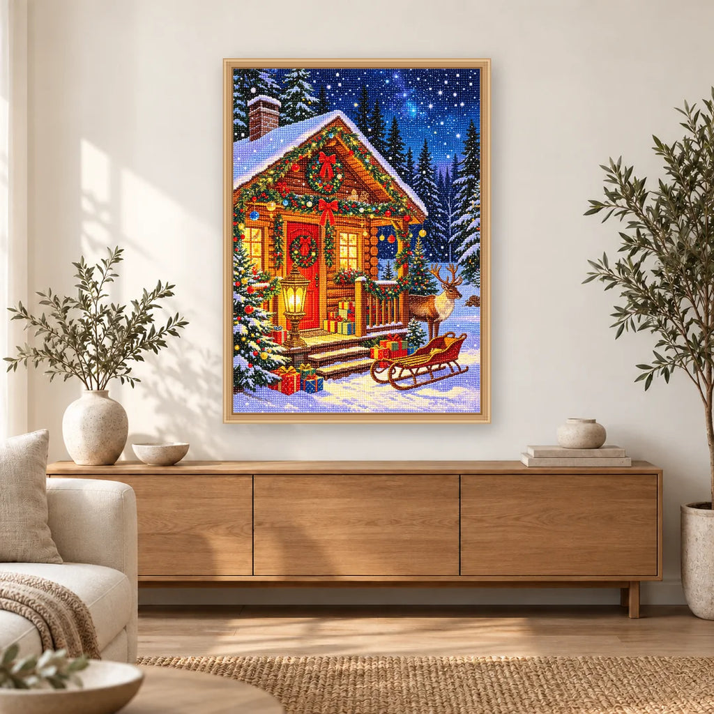 Snowy Christmas Cabin diamond painting displayed in a bright home interior