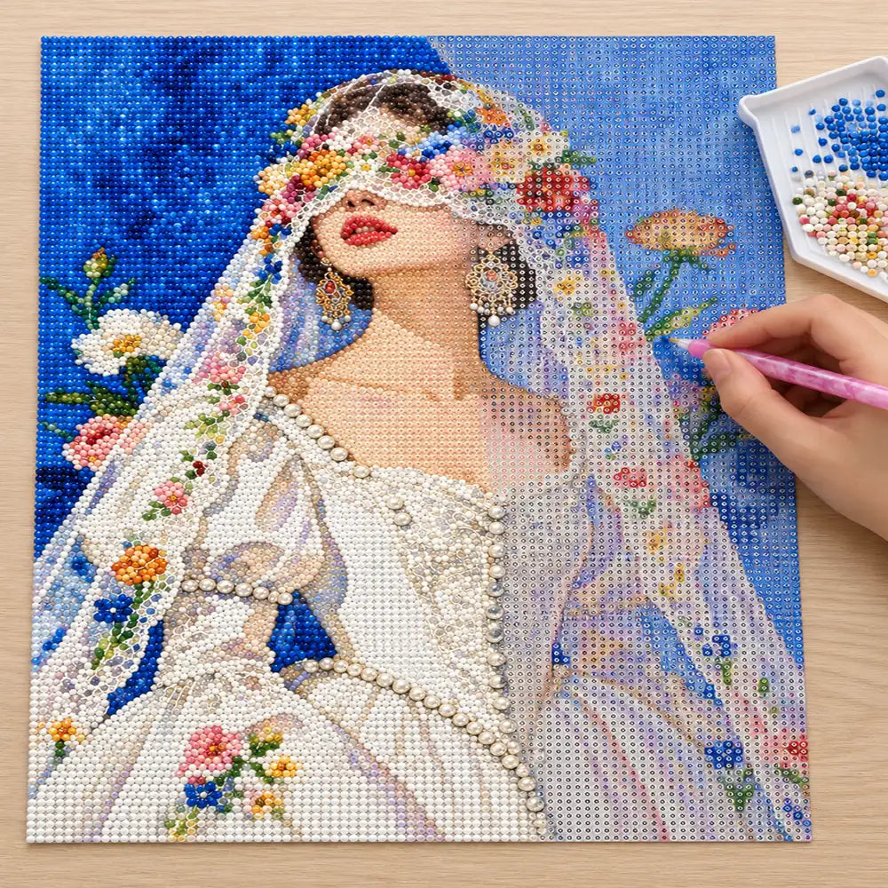 Diamond painting process showing a bride in a floral veil being completed with a stylus