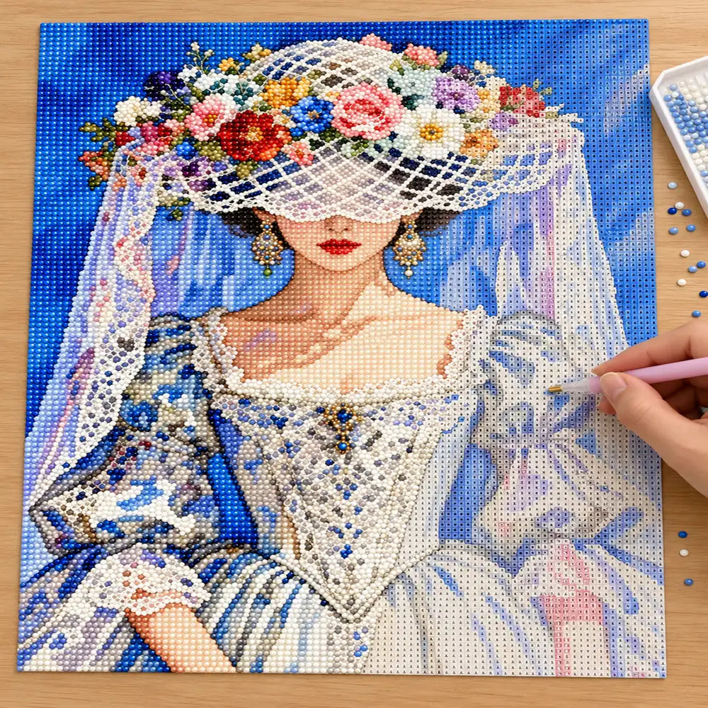 Diamond painting process showing a flower hat bride design being completed with a stylus