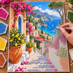 Hands placing diamond drills on the Amalfi Coast design.