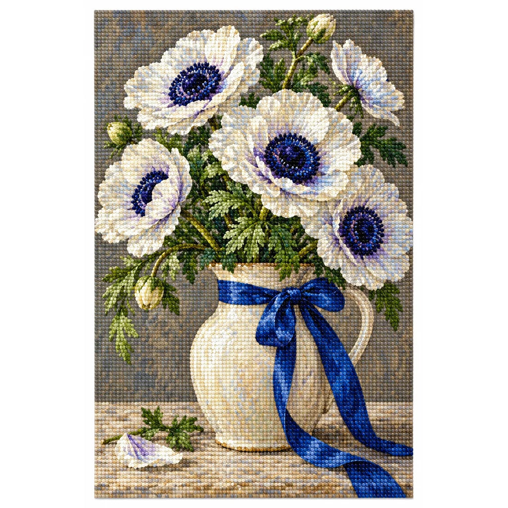White anemones with deep navy centers and green leaves in a ceramic vase tied with a cobalt ribbon: finished diamond painting on a clean white background