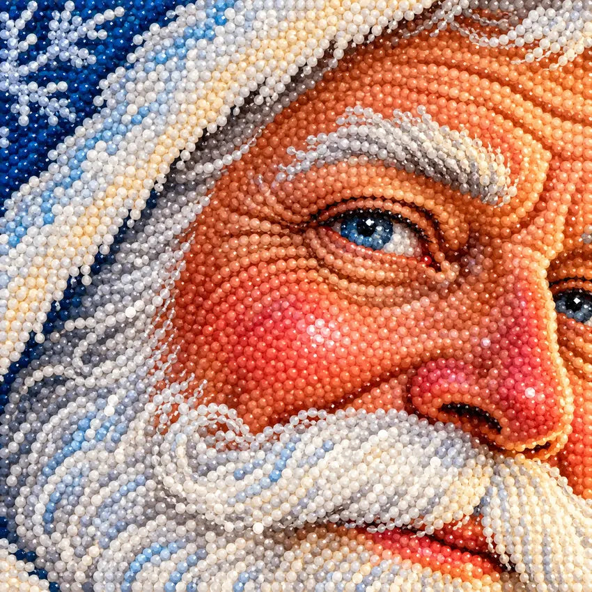 Close-up diamond drill detail of a blue-robed Santa beneath northern lights over snowy mountains artwork