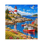 Finished diamond painting of an Atlantic lighthouse and harbor on a white background