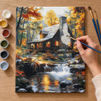 Complete Autumn Cabin by Waterfall numbered canvas being painted with acrylic paints and brushes