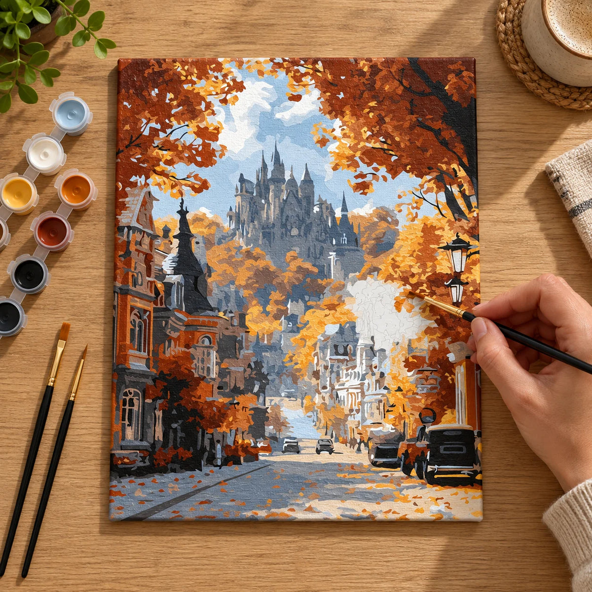 Complete Autumn Castle Street numbered canvas being painted with acrylic paints and brushes