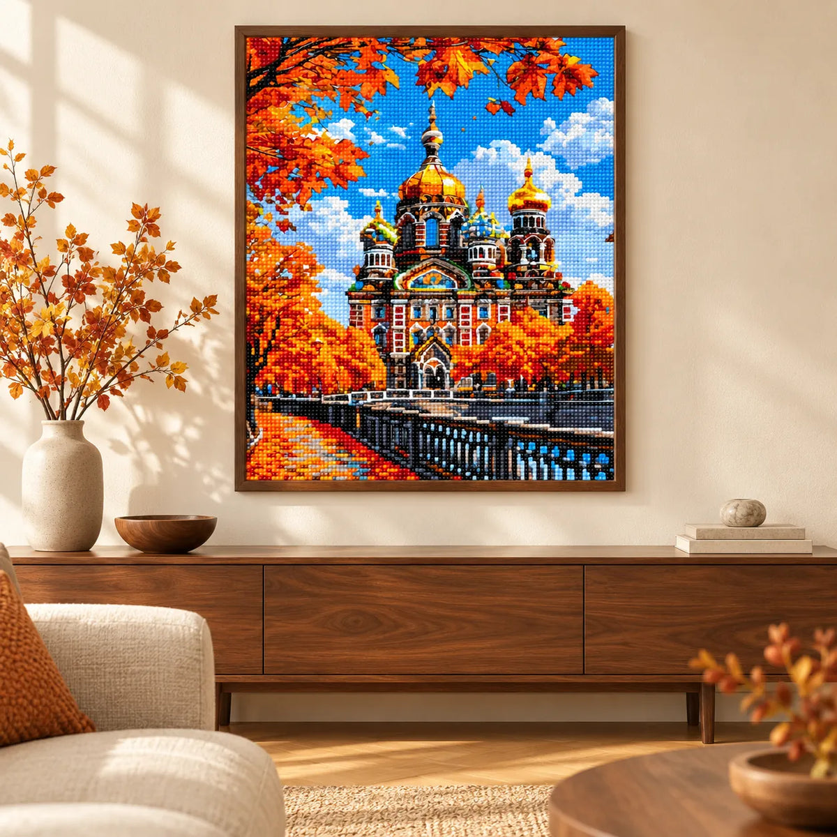 Home decor scene featuring a diamond painting of an ornate cathedral with golden domes among orange autumn leaves.