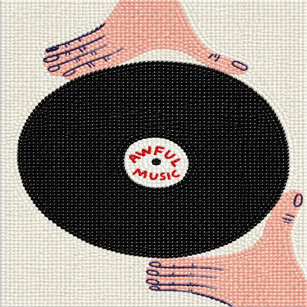Finished diamond painting of a black vinyl record held in two hands, with “Awful Music” at its center.