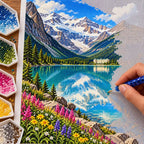 Hands placing diamond drills on the Banff Lake Louise design.