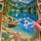 Hands placing diamond drills on the Bavarian Alpine Lake design.