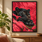 Framed home decor scene featuring a diamond painting of a black panther reclining among vivid coral leaves displayed on a wall.