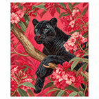 Finished diamond painting showing a black panther among pink flowering branches.