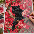 Hands applying drills to a canvas with a black panther among pink flowering branches.