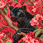 Close-up of diamond drills on artwork of a black panther among pink flowering branches.