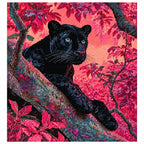 Finished diamond painting showing a black panther resting on a branch in a coral-colored forest.