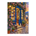 Finished diamond painting of a blue bookshop doorway, colorful shelves, roses, and cobblestones on a white background.