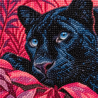 Close-up of diamond drills on artwork of a blue-eyed black panther surrounded by magenta foliage.