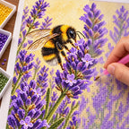 Hands placing drills on the bumblebee lavender diamond painting