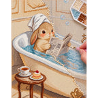 Diamond painting process showing a bunny reading in a bathtub being completed with a stylus