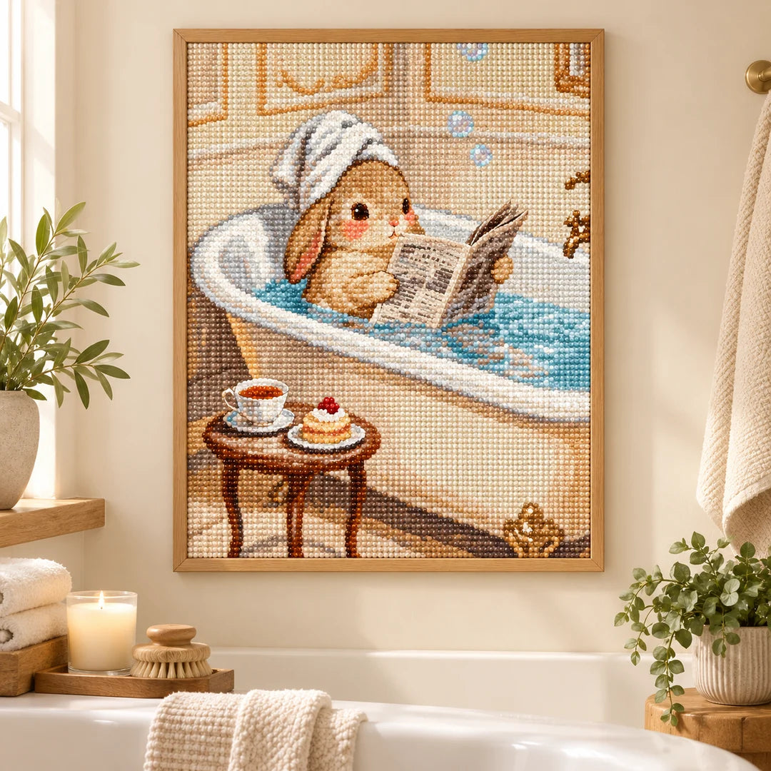 Bunny reading in a bathtub diamond painting displayed as home decor